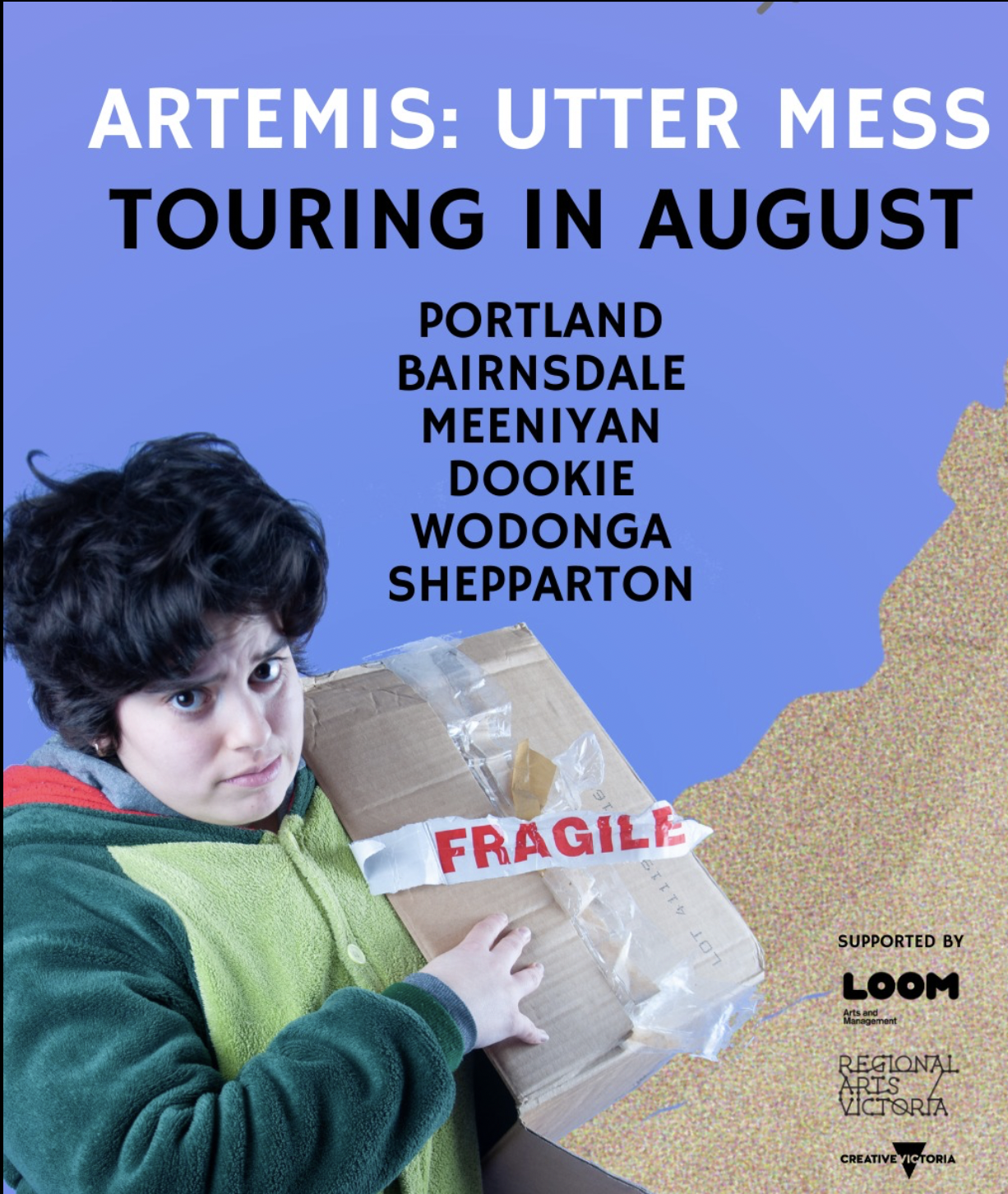 Artemis with short messy hair stares at you with a concerned expression. They wear a green dinosaur onsie and have their arm in a carboard box marked with FRAGILE tape. Text reads: TOURING IN AUGUST, ARTEMIS: UTTER MESS, Portland, Bairnsdale, Meeniyan, Dookie, Wodonga, Shepparton.