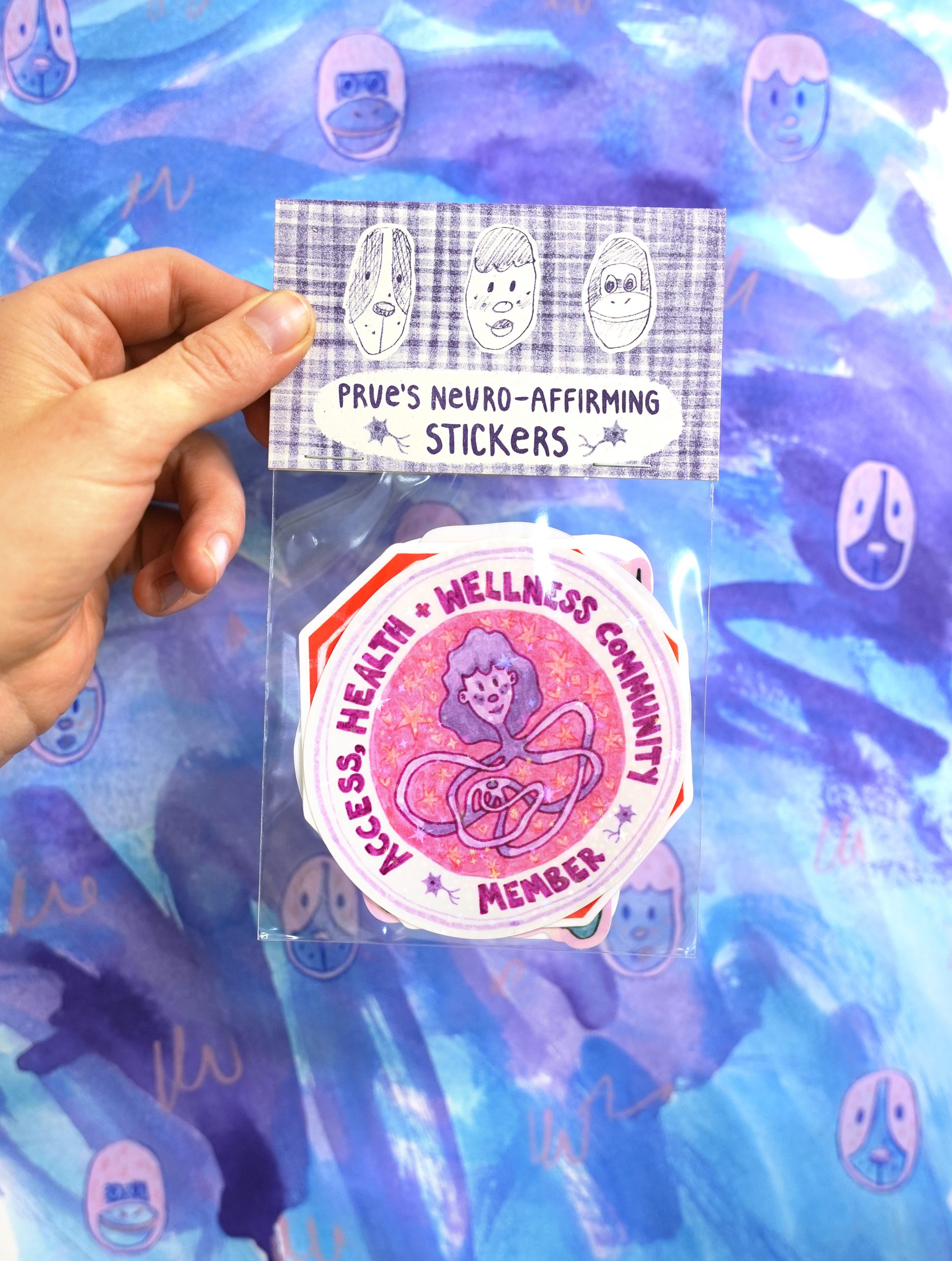 'Prue's Neuro- Affirming Sticker Pack' by Prue Stevenson. A hand holding the full pack of stickers with the label reading 